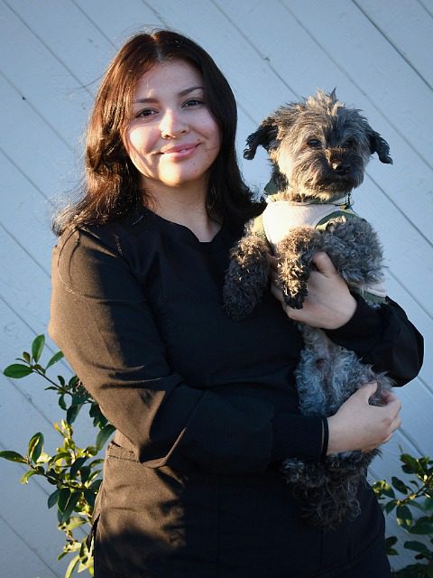 Stephanie - female holding small dog
